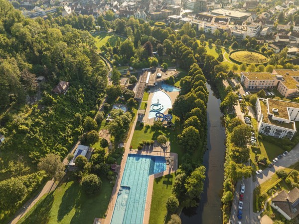 Outdoor pool complex with large swimming pools and surrounding green areas, embedded in a park landscape close to the city centre, Nagold, Black Forest, Germany, Europe