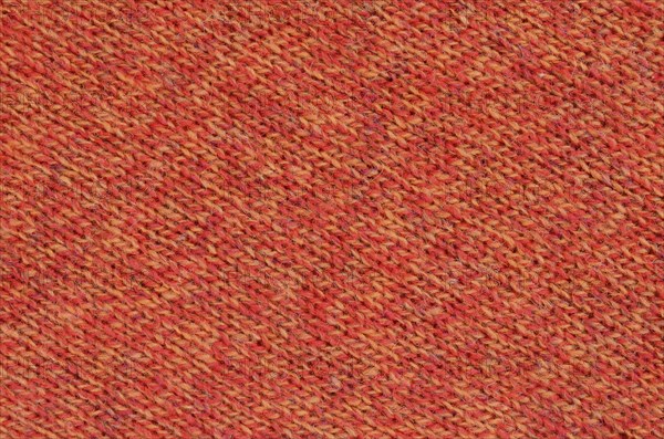 Abstract Background Texture Of Knitted Orange Wool Fabric