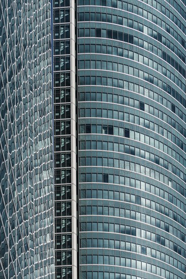 Madrid, Spain, February 7, 2021: Full frame of glass facade of skyscraper in Cuatro Torres financial district. Business and finance concept, Europe