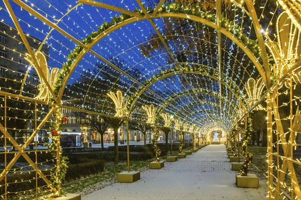Fantastic Christmas decoration in Warsaw on Krakowskie Przedmiescie street, amazing blue sky at morning