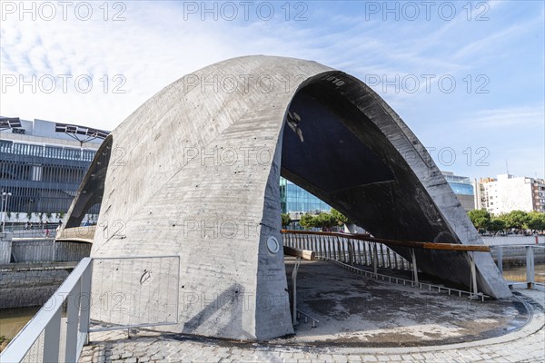 Madrid, Spain, December 9, 2019: Modern concrete bridge over Manzanares River in Madrid RIo area, Europe