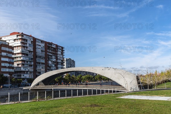 Madrid, Spain, December 9, 2019: Modern concrete bridge over Manzanares River in Madrid RIo area, Europe