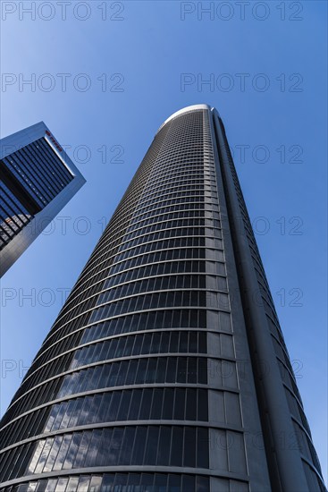 Madrid, Spain, February 7, 2021: Low angle view of skyscrapers in Cuatro Torres financial district. Business and finance concept, Europe