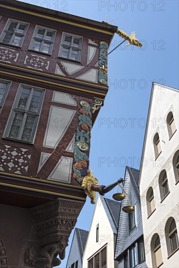 Corner detail of a colorful half timbered house, house to the Golden Libra, in the new historic old town of Frankfurt am Main, Germany, Europe