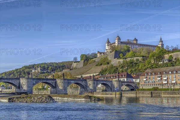 View of Marienberg Fortress with Alte Mainbrucke from main river, Wurzburg, Germany, Europe