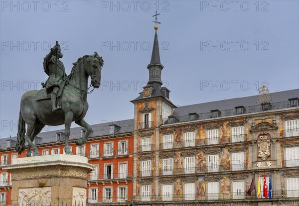 Madrid, Spain, 6 April, 2024: statue of Felipe II and the landmark buildings of the Plaza Mayor city square in downtown Madrid, Europe
