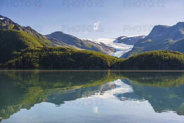 Glacier tongue of the Svartisen glacier reflected in glacial lake, Helgeland coast, Nordland, Norway, Europe