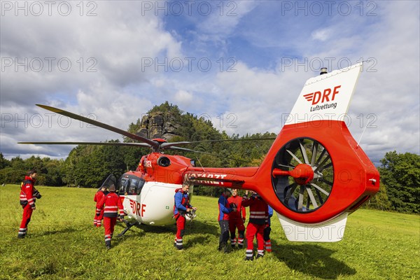 Winch rescue training of the rescue helicopter, Christoph 62, on the occasion of the 50th anniversary of the DRF Luftrettung. The rescue of casualties in the Elbe Sandstone Mountains will be practised