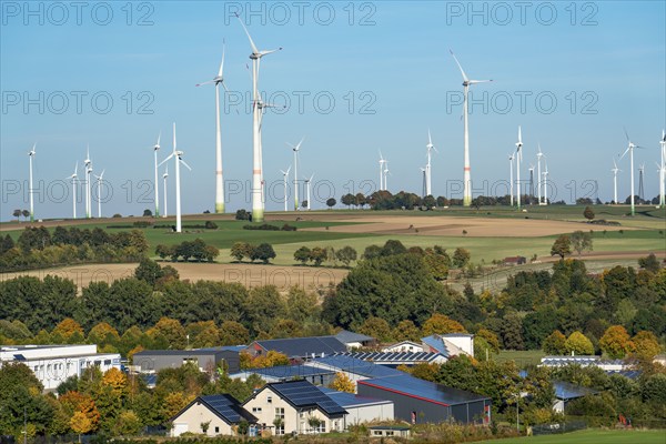 Wind farm above the village of Lichtenau, self-proclaimed energy town, houses with photovoltaic systems on the roofs, Paderborn district, OWL, A North Rhine-Westphalia, Germany, Europe