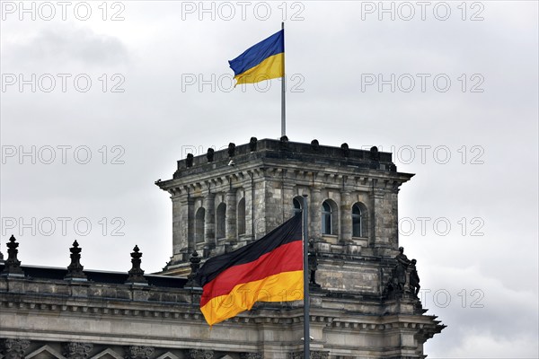 On the anniversary of the Russian war of aggression against Ukraine, Ukrainian flags are hoisted at the Reichstag, Berlin, 24 February 2023