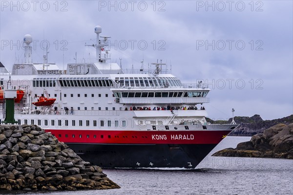 Ship 'Kong Harald' of Hurtigruten company is approaching harbor of Stamsund, island Vestvagøy, Lofoten, Norway, Europe