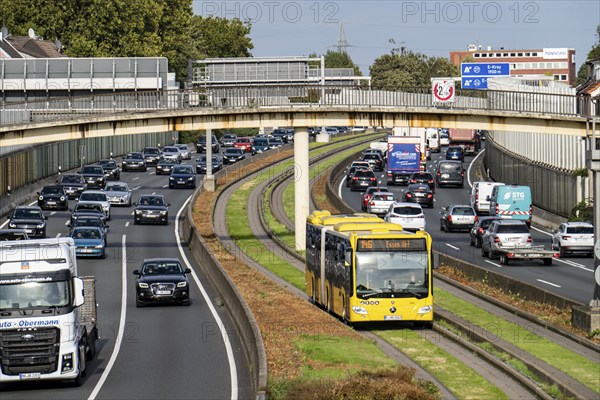 Traffic jam on the A40 motorway, Ruhr expressway, bus lane in the middle of the carriageway, public transport can run without traffic jams, in Essen, near the Essen-Ost motorway junction, North Rhine-Westphalia, Germany, Europe