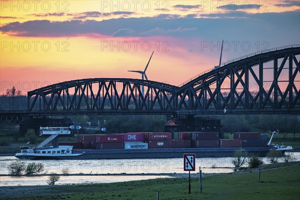 Cargo ship on the Rhine near Duisburg-Beeckerwerth, Haus-Knipp railway bridge, Duisburg, North Rhine-Westphalia, Germany, Europe