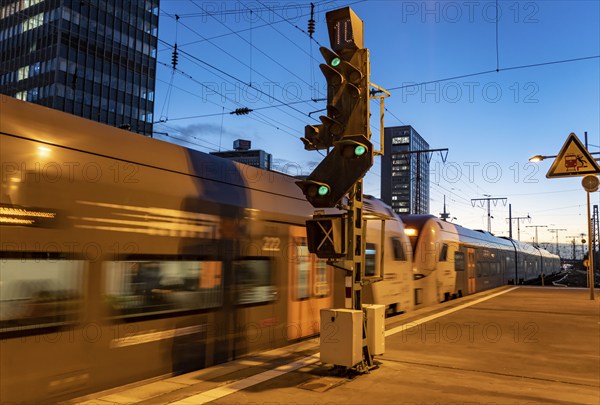 Railway station, RRX regional express train on the platform, skyline of Essen city centre, North Rhine-Westphalia, Germany, Europe