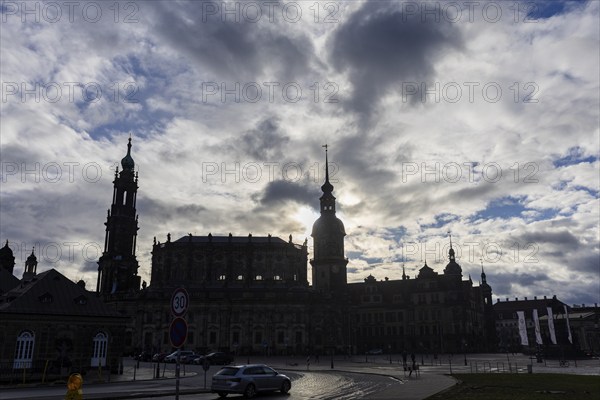 Rainy weather in Dresden's old town. The steep winter sun emphasises the silhouettes of the historic buildings Residenzschloss with Hausmannsturm and Hofkirche, Dresden, Saxony, Germany, Europe