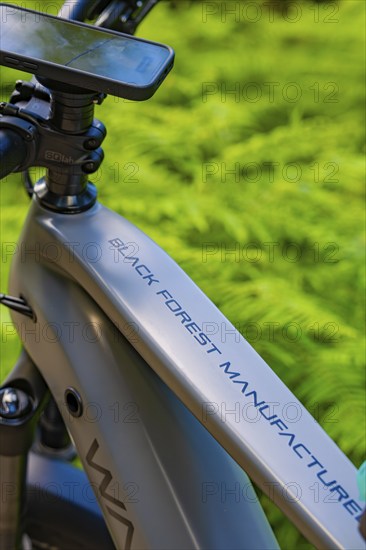 Close-up of an e-bike in the forest, the lettering 'Black Forest Manufacture' is clearly visible, Gechingen, Black Forest, Germany, Europe