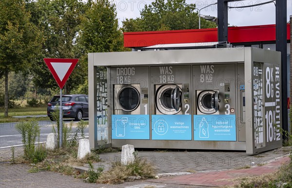 Self-service washing machines, for laundry, clothing, open 24 hours, around the clock, at a petrol station, on the border of Germany and the Netherlands in Venlo