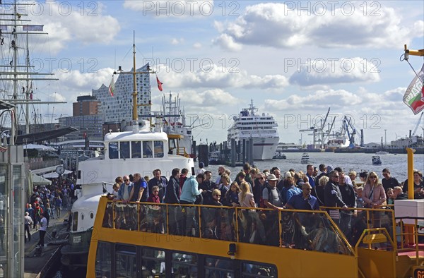 Europe, Germany, Hanseatic City of Hamburg, Elbe, Elbe Philharmonic Hall, glass facade, harbour tour with harbour ferry, many tourists, passenger ship Europa at the Überseebrücke, Hamburg, Hamburg, Federal Republic of Germany, Europe