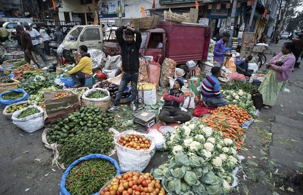 Vendor selling vegetables at a market, ahead of the presentation of the Interim Budget 2024 by Union Finance Minister Nirmala Sitharaman, in Guwahati, Assam, India on Thursday, Feb. 1, 2024