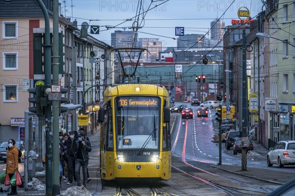 Ruhrbahn tram, on Altendorfer Straße, in the background the skyline of Essen city centre, rush hour, evening traffic, Essen, North Rhine-Westphalia, Germany, Europe