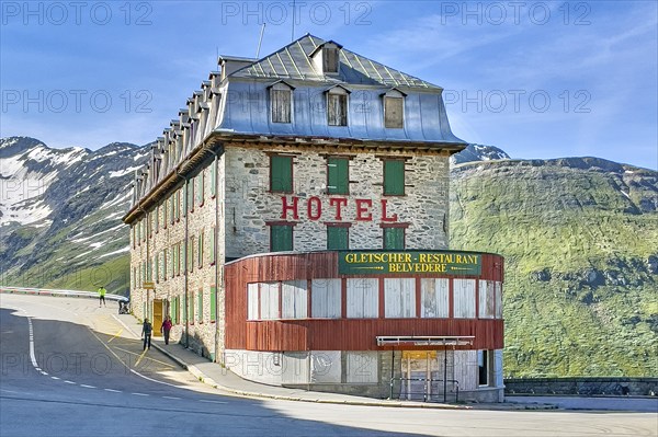 Photo with HDR effect of abandoned former now closed historic Hotel Gletscher-Restaurant Belvedere on Furka pass road mountain road alpine pass Furka Pass, Alps, Canton Valais, Switzerland, Europe