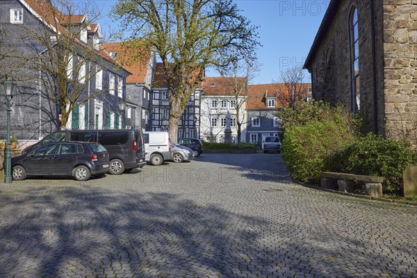 Church square with residential buildings and façade of St George's Church in the old town centre of Hattingen, Ennepe-Ruhr district, North Rhine-Westphalia, Germany, Europe
