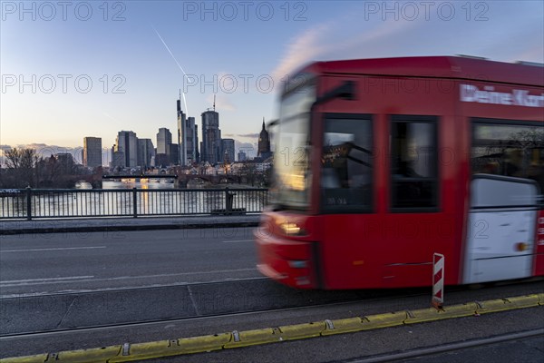 Skyline of the city centre of Frankfurt am Main, river Main, dusk, tram on the Ignatz-Bubis-Bridge, Hesse, Germany, Europe