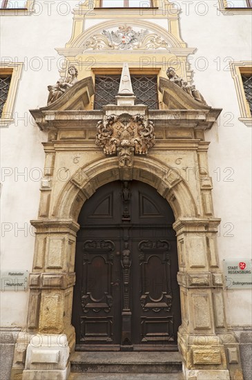 Entrance portal with the alegories of Faith and Peace from the Baroque town hall from 1661, Regensburg, Upper Palatinate, Bavaria, Germany, Europe