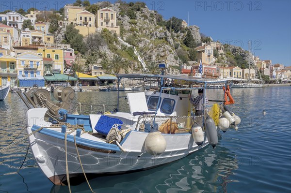 Fishing boat in the harbour of Symi town, Symi island, Dodecanese, Greek islands, Greece, Europe