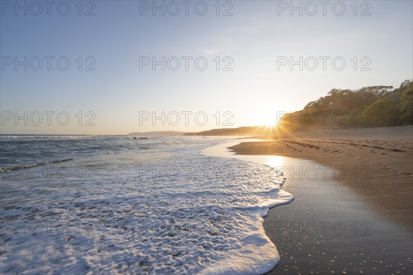 Sandy beach beach and sea at sunset, Playa Cocalito, coastal landscape, Pacific coast, Nicoya Peninsula, Puntarenas Province, Costa Rica, Central America