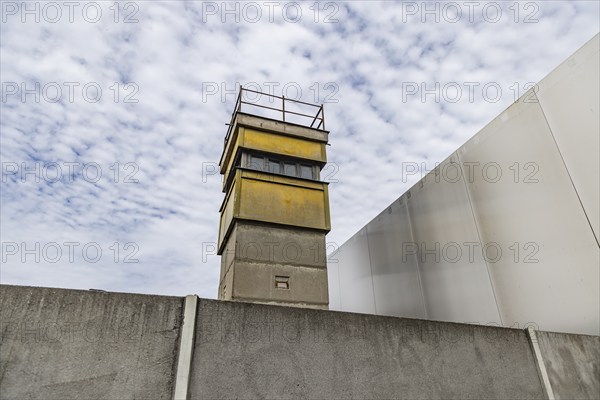 Berlin Wall Memorial, sight and reminder of the division by the Berlin Wall and of the fatalities at the border. Original preserved border strip with watchtower on Bernauer Strasse, Berlin, Germany, Europe