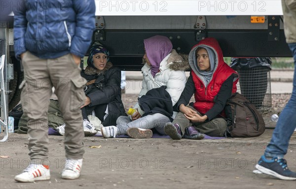 Refugees from Syria waiting to be registered at the Central Reception Centre for Asylum Seekers at the Berlin State Office for Health and Social Affairs, 09.10.2015