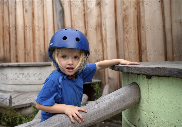Little girl, 3 years, blonde, helmet, helmet, playing, adventure playground, playground, Stuttgart, Baden-Württemberg, Germany, Europe