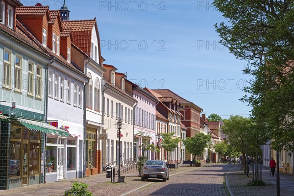 Residential and commercial buildings in Ernst-Thälmann-Straße, paved with cobblestones, in the old town centre of Gardelegen in the Altmark. Hanseatic town of Gardelegen, Saxony-Anhalt, Germany, Europe