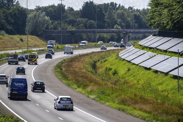 A58 motorway, photovoltaic systems were installed on the slopes to the side of the carriageway, use of the areas along the roads as a solar park, near Etten-Leur, Noord-Brabant, Netherlands