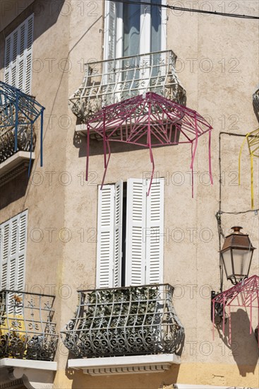 Small balconies and white shutters in the old town centre of Sainte-Maxime, Provence-Alpes-Côte d'Azur, France, Europe
