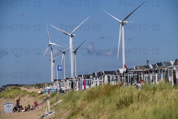 Wind turbines, wind farm, holiday homes, beach houses on the beach of Ijmuiden in North Holland, Netherlands