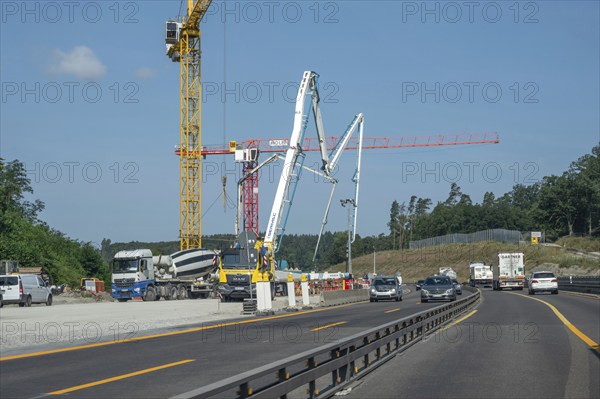 Construction cranes at a building site on the A6 motorway, Bavaria, Germany, Europe