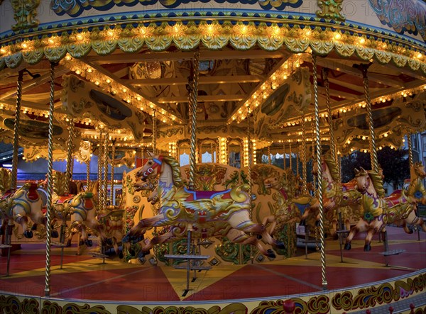 Fairground carousel ride with horses and no people, Weymouth, Dorset, England, United Kingdom, Europe