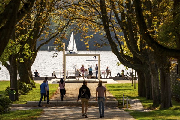 Promenade on Lake Baldeney, jetty for the ships of the White Fleet, lido, sailing boats on the lake, a Ruhr reservoir, in Essen North Rhine-Westphalia, Germany, Europe