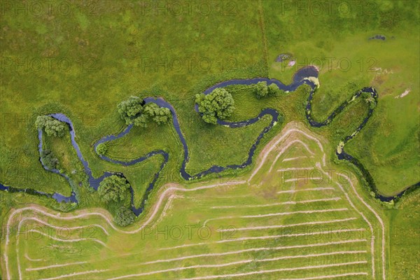 Aerial view over meander belt in meandering Klingavälsån river, tributary to Kävlingeån in the southern part of Skåne, Sweden, Scandinavia, Europe