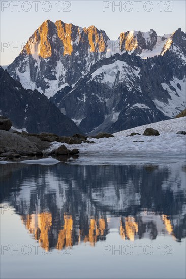 Morning atmosphere, mountain landscape at sunrise, reflection in Lac Blanc, mountain peak Grandes Jorasses, Mont Blanc massif, Chamonix-Mont-Blanc, Haute-Savoie, France, Europe
