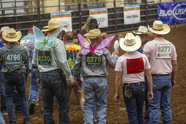 Oklahoma City, Oklahoma, The Great Plains Rodeo, an annual gay rodeo that features traditional rodeo competition while emphasizing the camaraderie of the LGBTQ community. Participants line up to receive a pair of underpants that will be used in goat dressing, in which contestants try for the fastest time in placing the underpants on a goat