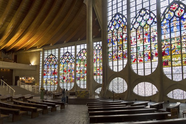 Rouen, France, August 30, 2018: Old Renaissance stained glass windows in a modern catholic church of Saint Joan of Arc, Europe