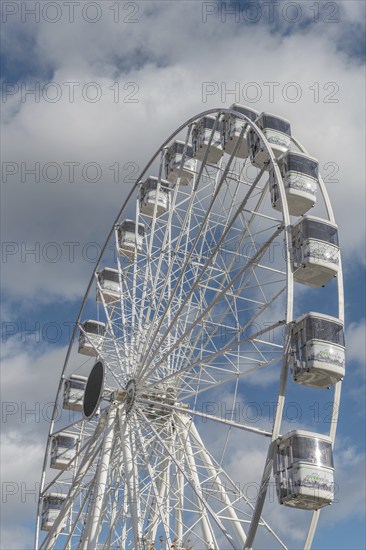 The solar-powered Ferris wheel at the Colmar Christmas market in 2022. Alsace, France, Europe