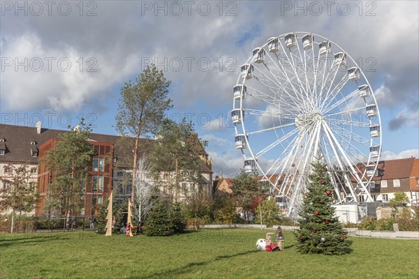 The solar-powered Ferris wheel at the Colmar Christmas market in 2022. Alsace, France, Europe