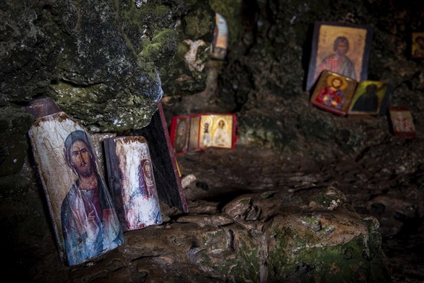 Protaras, Cyprus, August 6 2020: Interior of an old church cave with Christian saint. Ayioi Saranta orthodox chapel, Europe