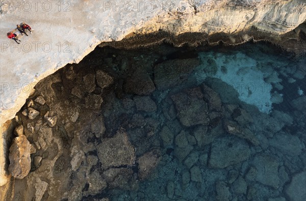 Done scenery of Cape Greko or Cape Greco sea caves Ayia Napa Cyprus. Tourist people doing sightseeing
