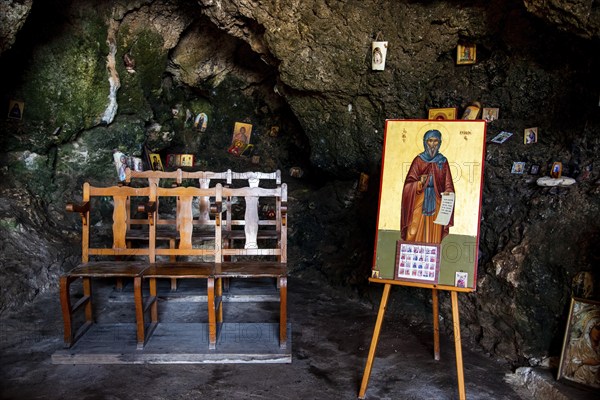 Protaras, Cyprus, August 6 2020: Interior of an old church cave with Christian saint. Ayioi Saranta orthodox chapel, Europe