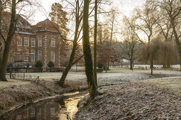 Winter river landscape at sunset with historic building, Velen, North Rhine-Westphalia, Germany, Europe